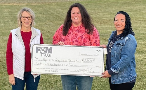 bank reps present large check to program rep